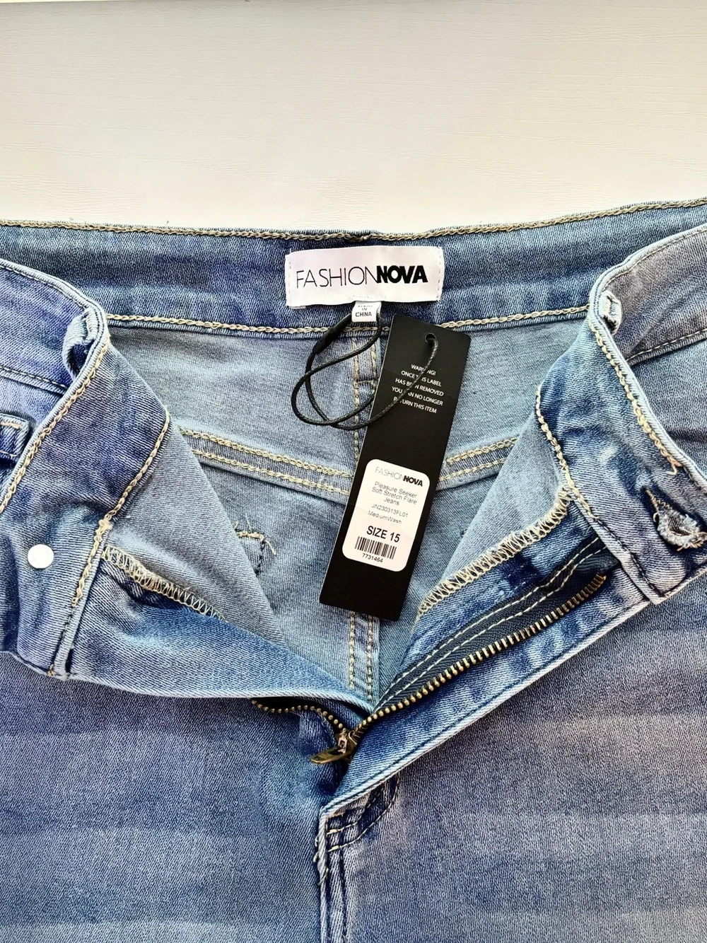 Fashion Nova Light Blue High-Rise Flare Jeans with Knee Rips - Picture 4 of 5